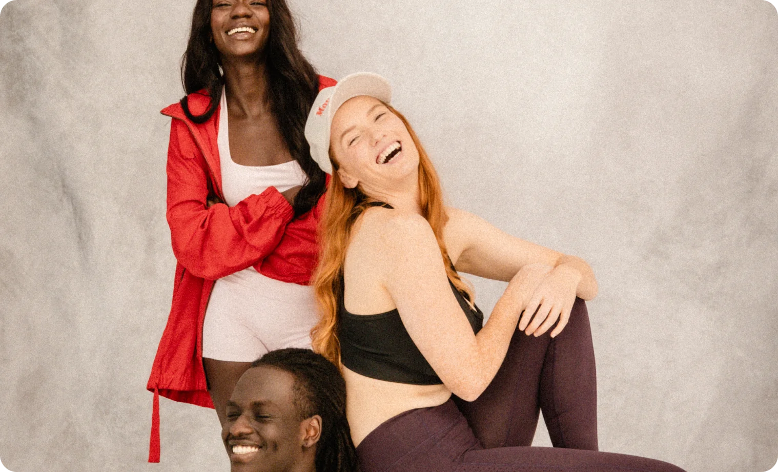 J.I.M members laughing together